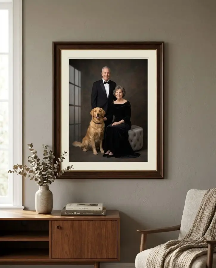 A framed studio photograph of an older couple in formal black attire posing with their golden retriever.