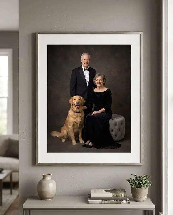 A framed studio photograph of a smiling senior couple in formal black attire posed with their golden retriever against a dark textured background.