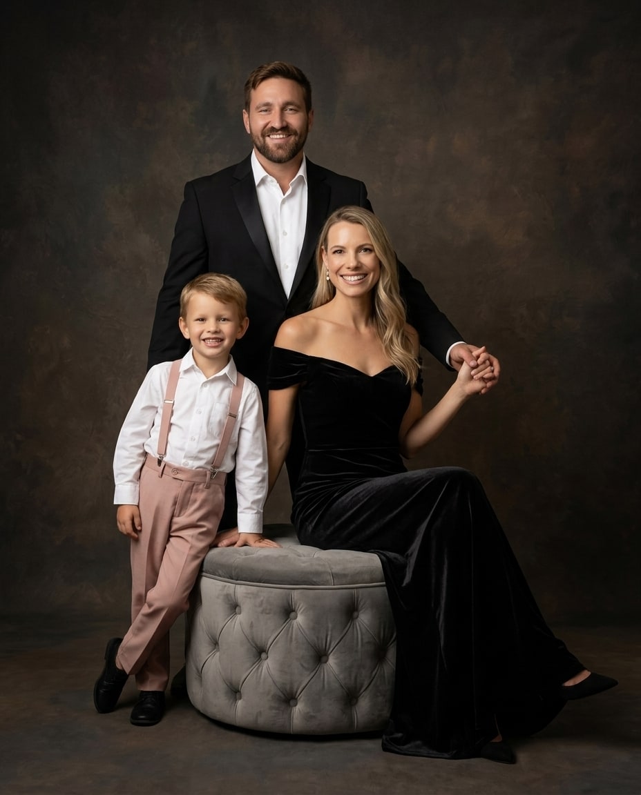 The same family of three as a fine-art heirloom portrait, in formal black